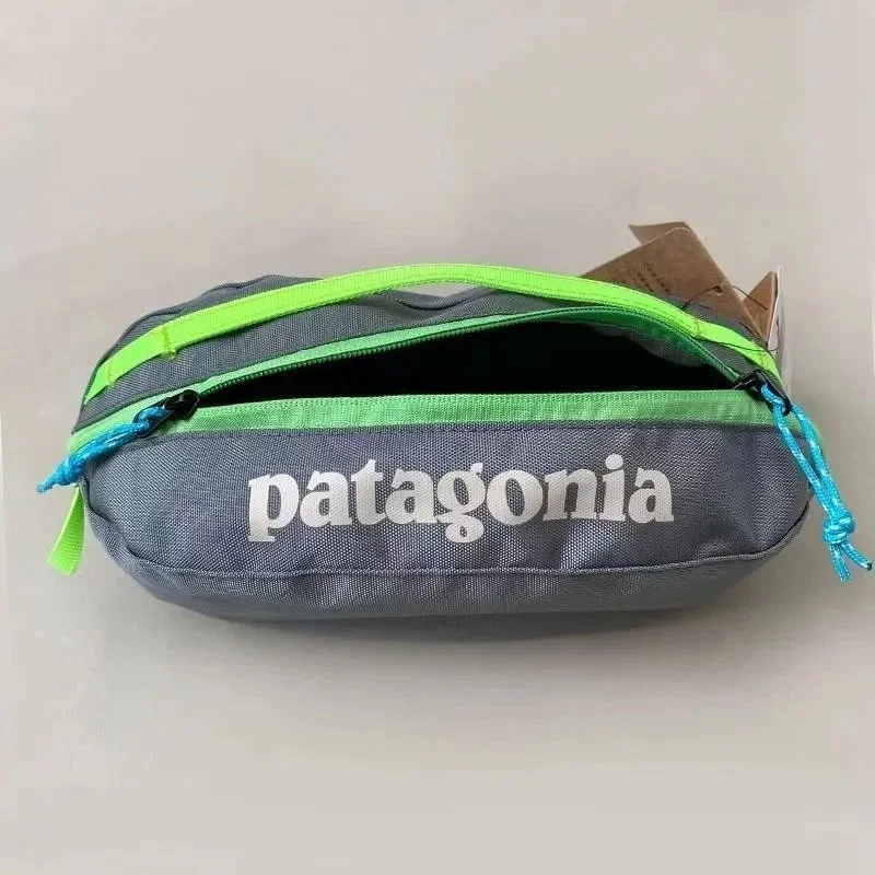 Patagonia Grey woven fabric waist pack with neon green zipper trim and
