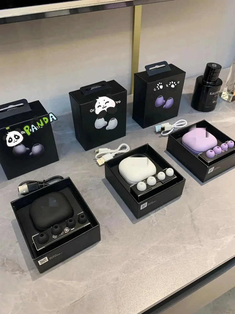 Black and white wireless earbuds with panda graphic packaging