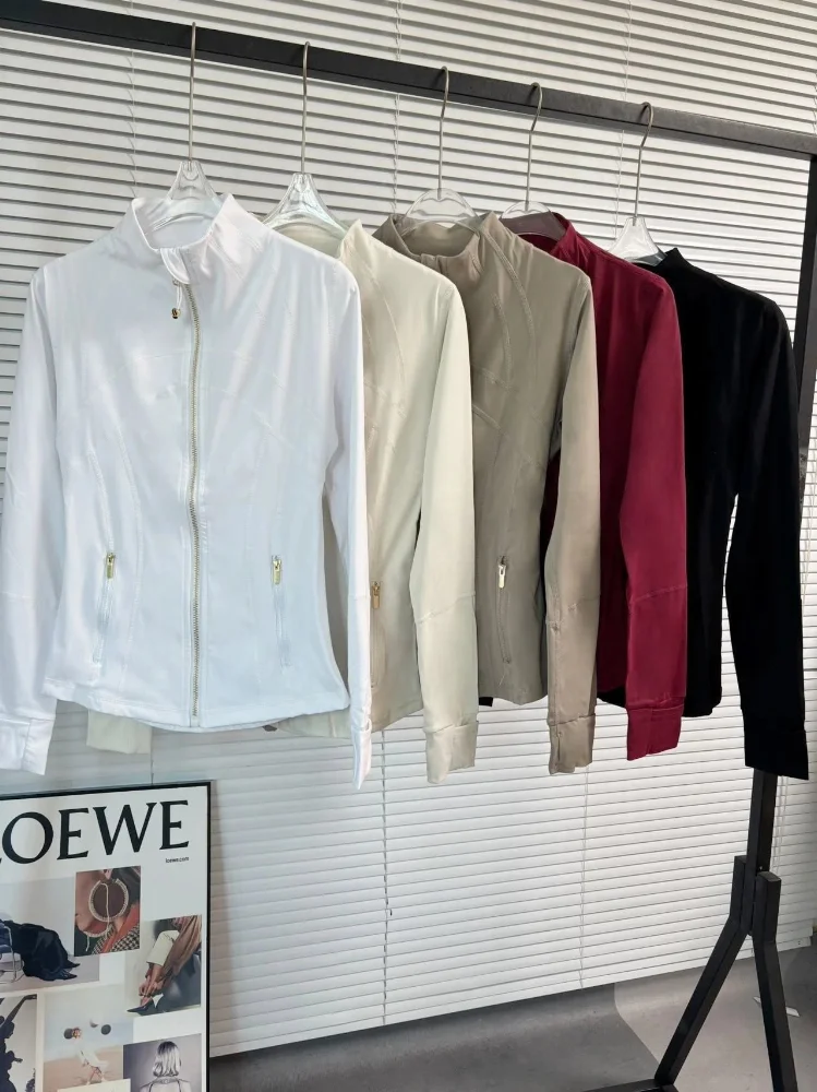 Black burgundy beige white zip-up jacket with gold zippers and diagonal seam detailing