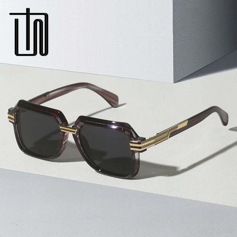Black acetate geometric frame sunglasses with gold metal accents
