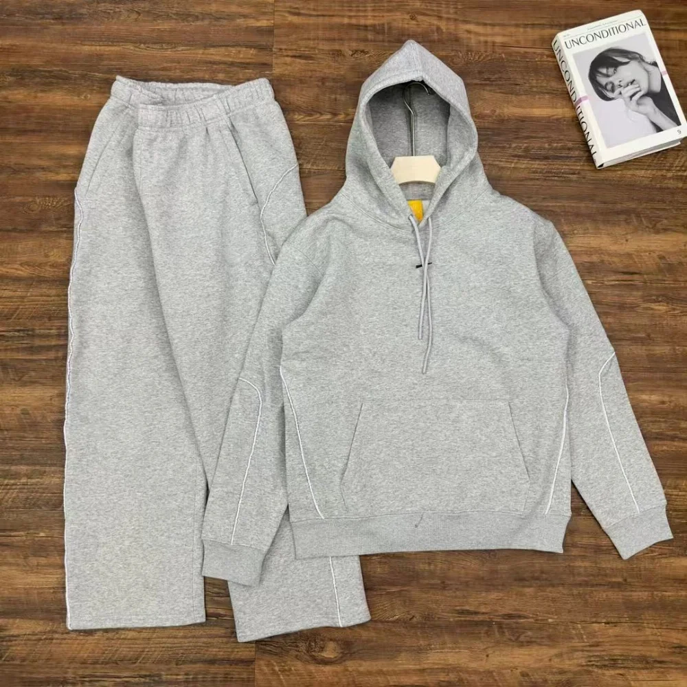 Grey or black heather fleece hoodie with contrast stitching and matching joggers