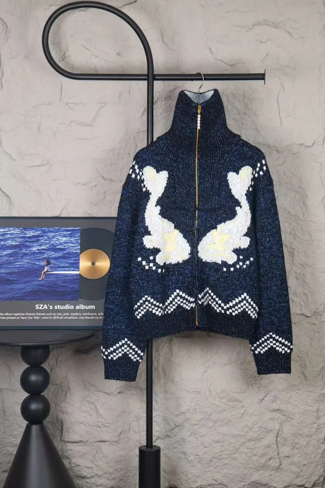 navy blue metallic knit zip-up sweater with white koi fish intarsia and zigzag patterns