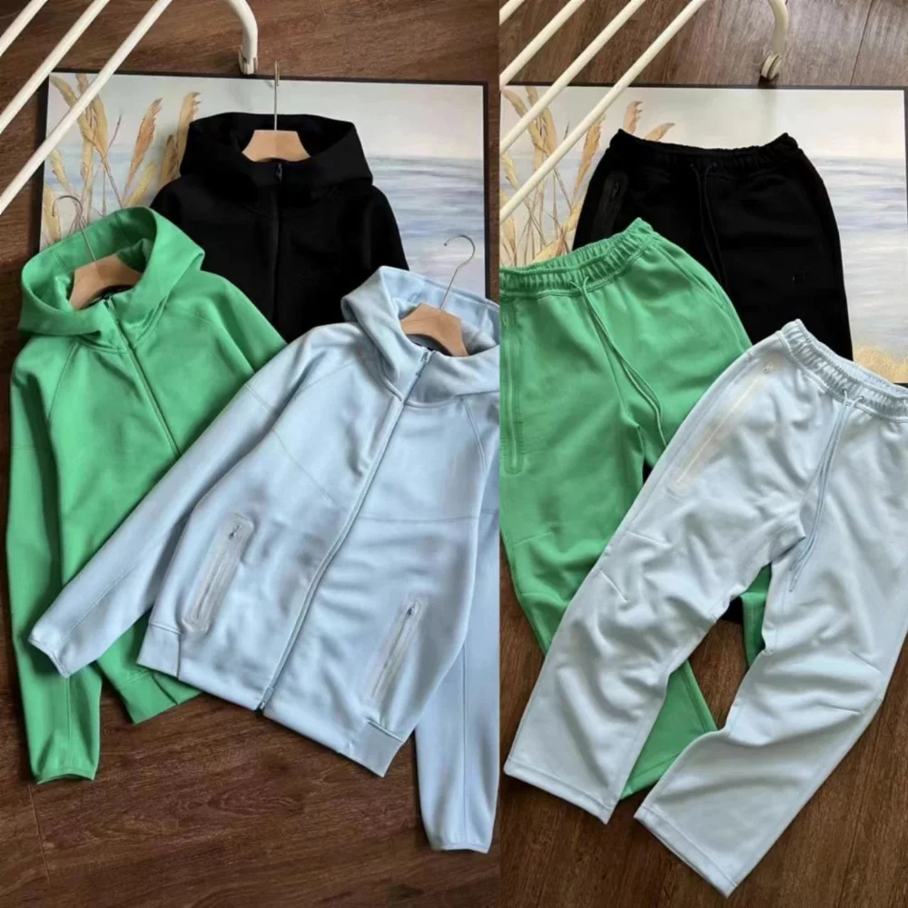 green and grey zippered hooded jacket with side pockets matching drawstring jogger pants