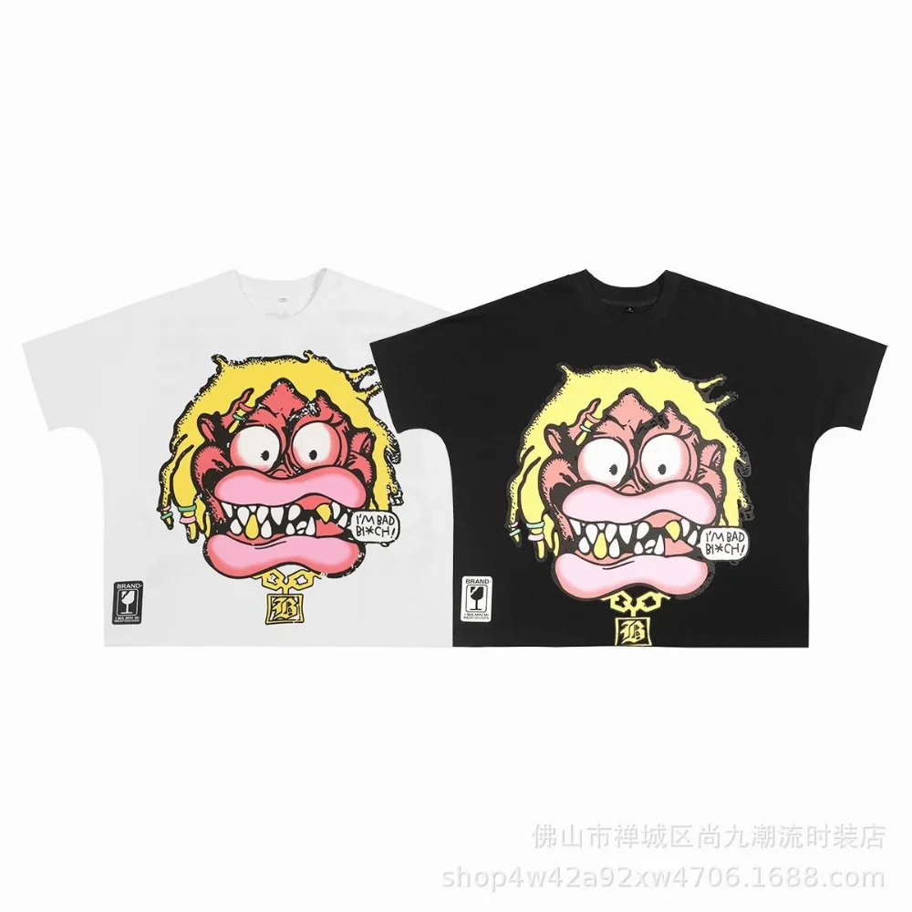 White and black oversized t-shirt with cartoon monster face graphic and speech bubble