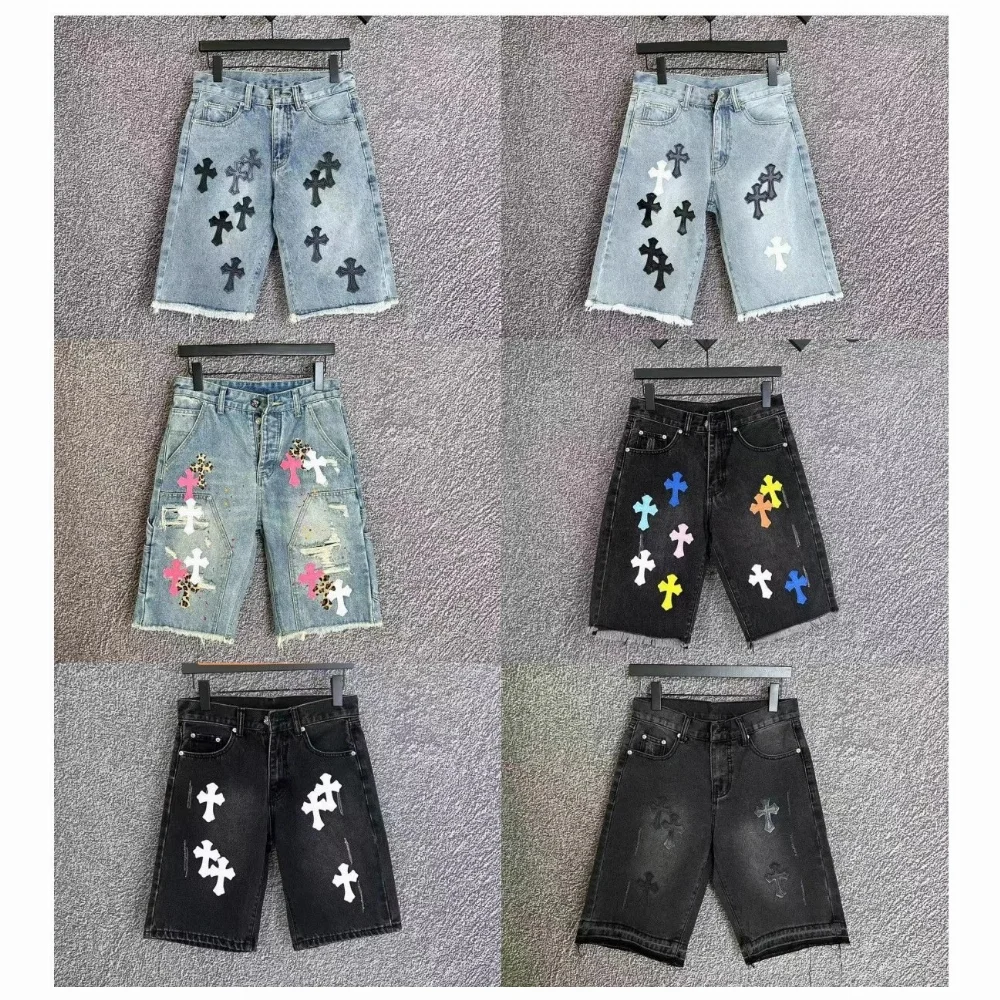 light wash denim shorts with black cross patches and frayed hem