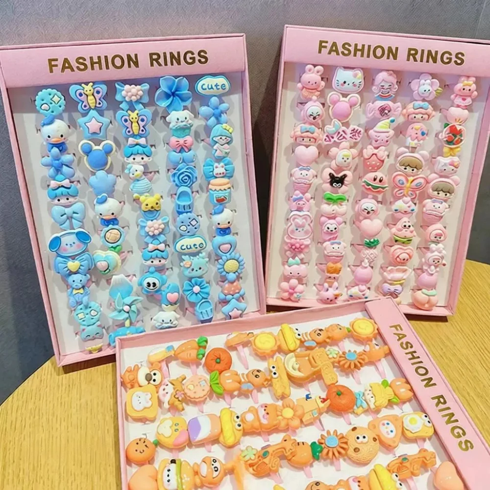 Colorful cartoon character resin rings in pink box