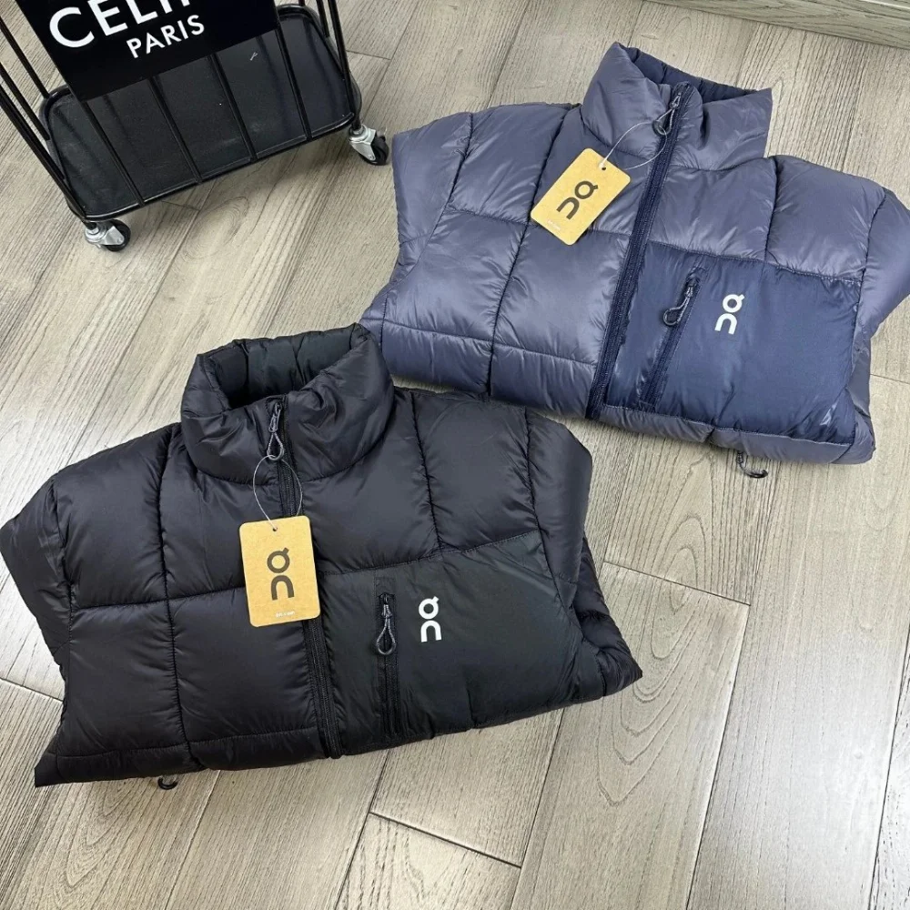 On black and navy quilted puffer jacket with stand collar and front
