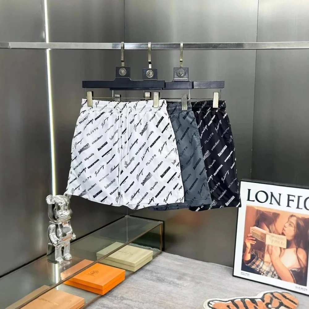 Balenciaga All-Over Logo Print Shorts