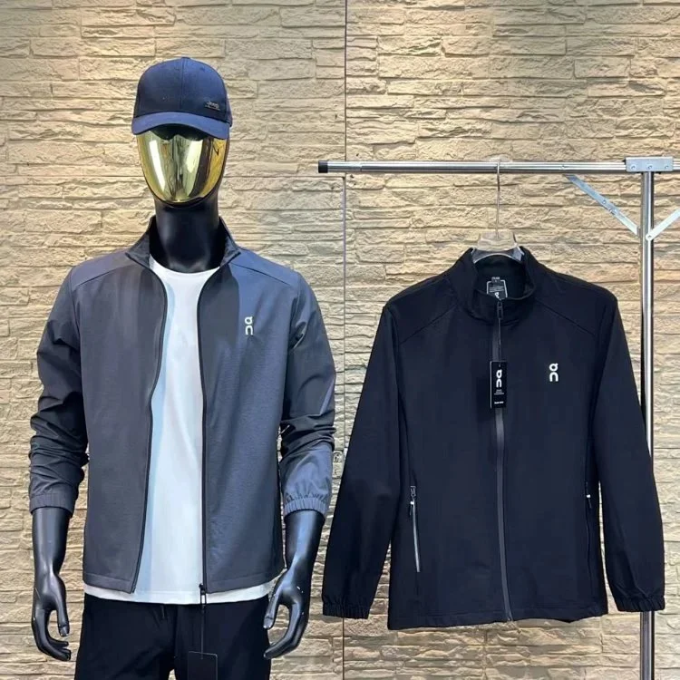 On black and grey zip-up lightweight sport jacket with small chest logo