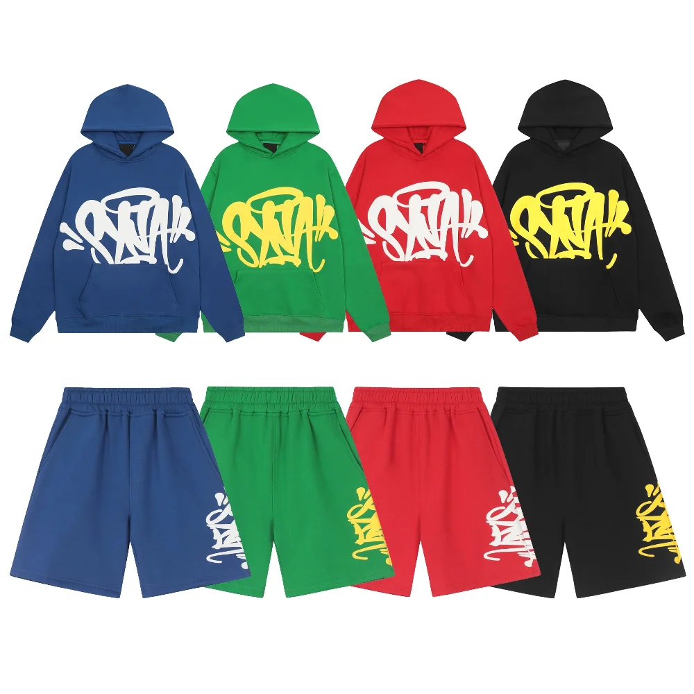 green and black sweatshorts with yellow graffiti print on side