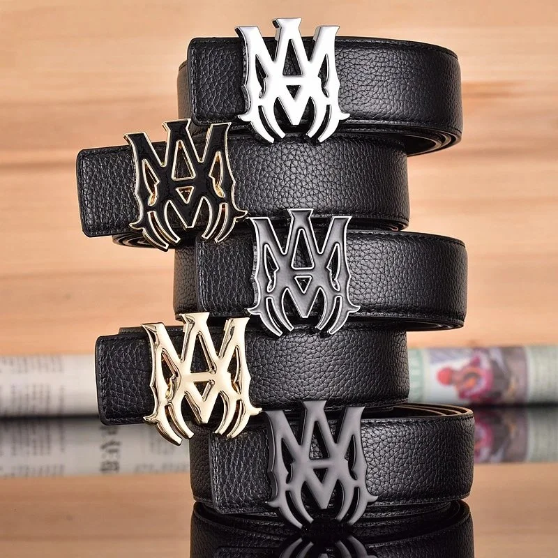 Black leather belt with sculpted metallic flame-style buckle