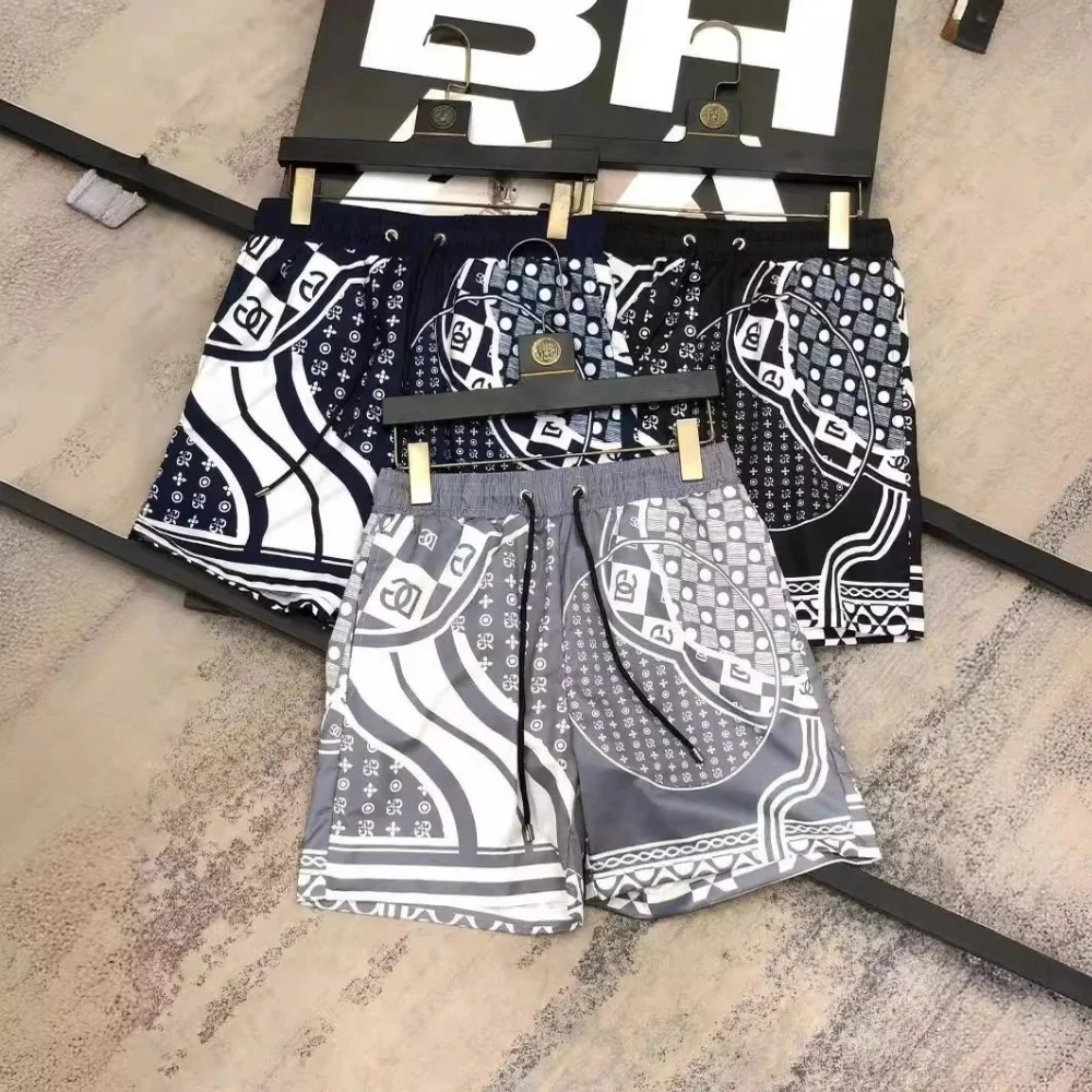 Black white and grey geometric print panelled shorts with elastic waist