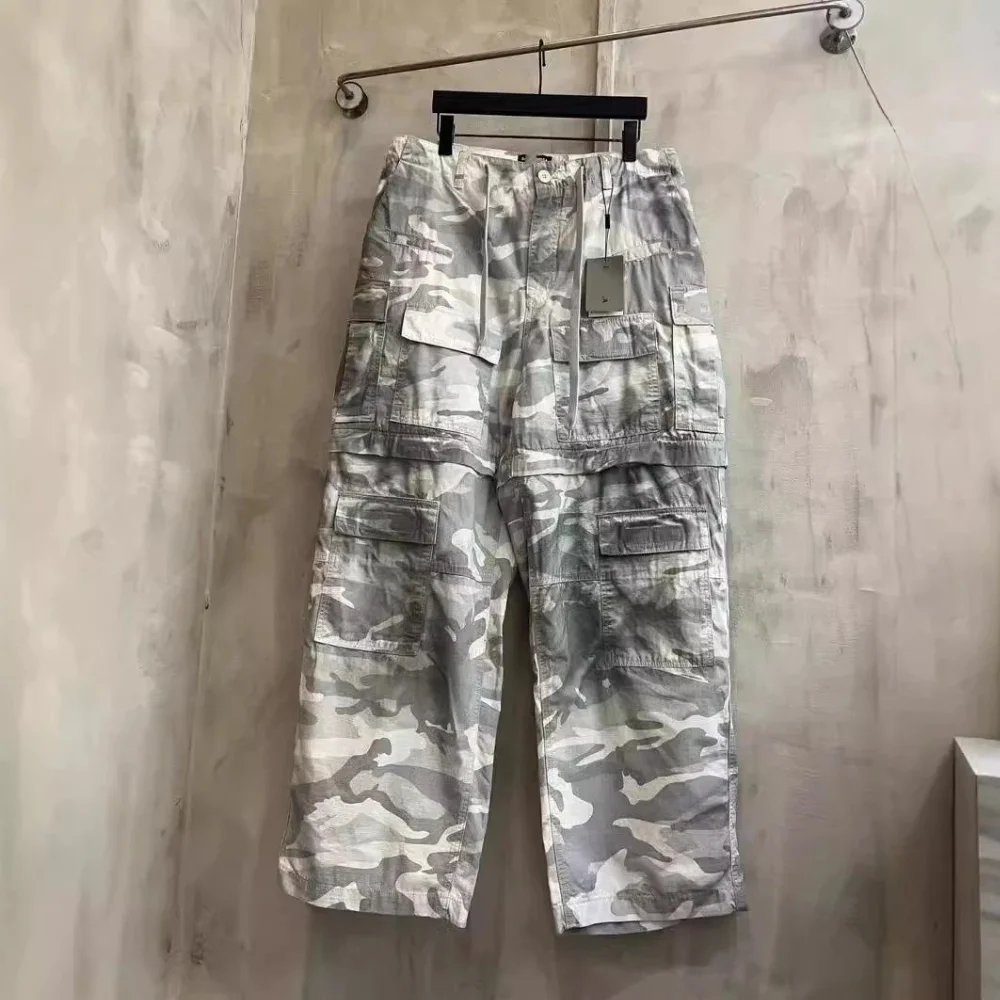 Grey and green camouflage print cargo capri pants with multiple flap pockets