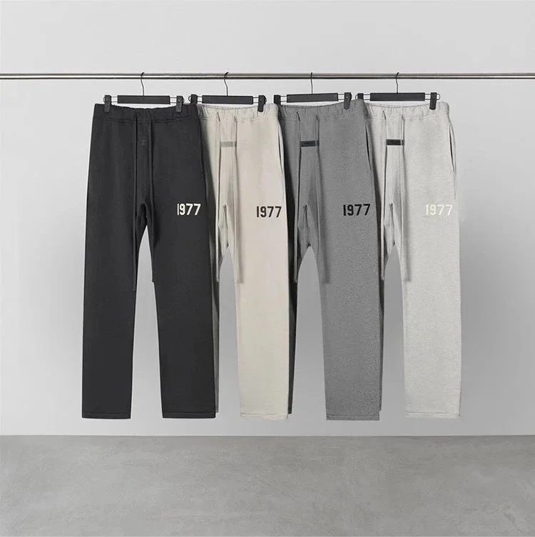 black and oatmeal heathered fleece sweatpants with 1977 print