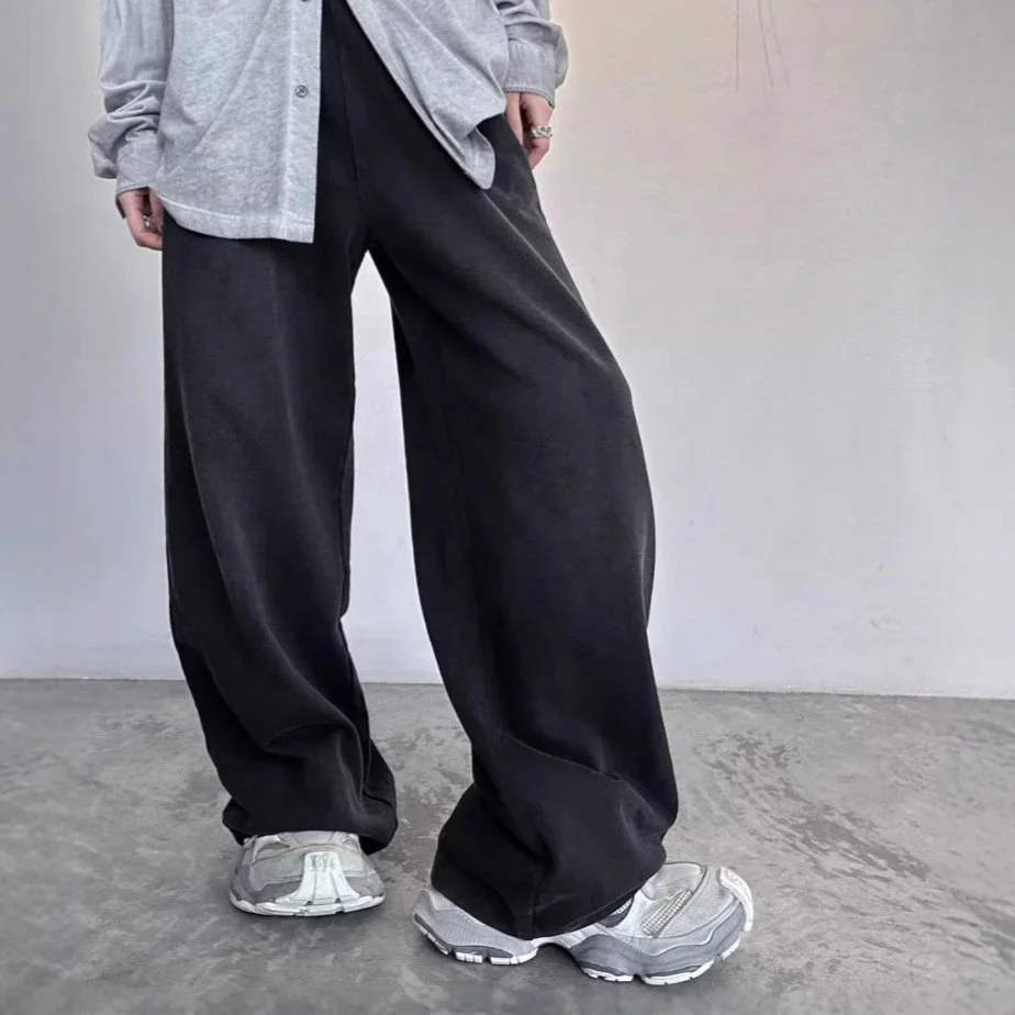 black drawstring waist pants with side zip pockets
