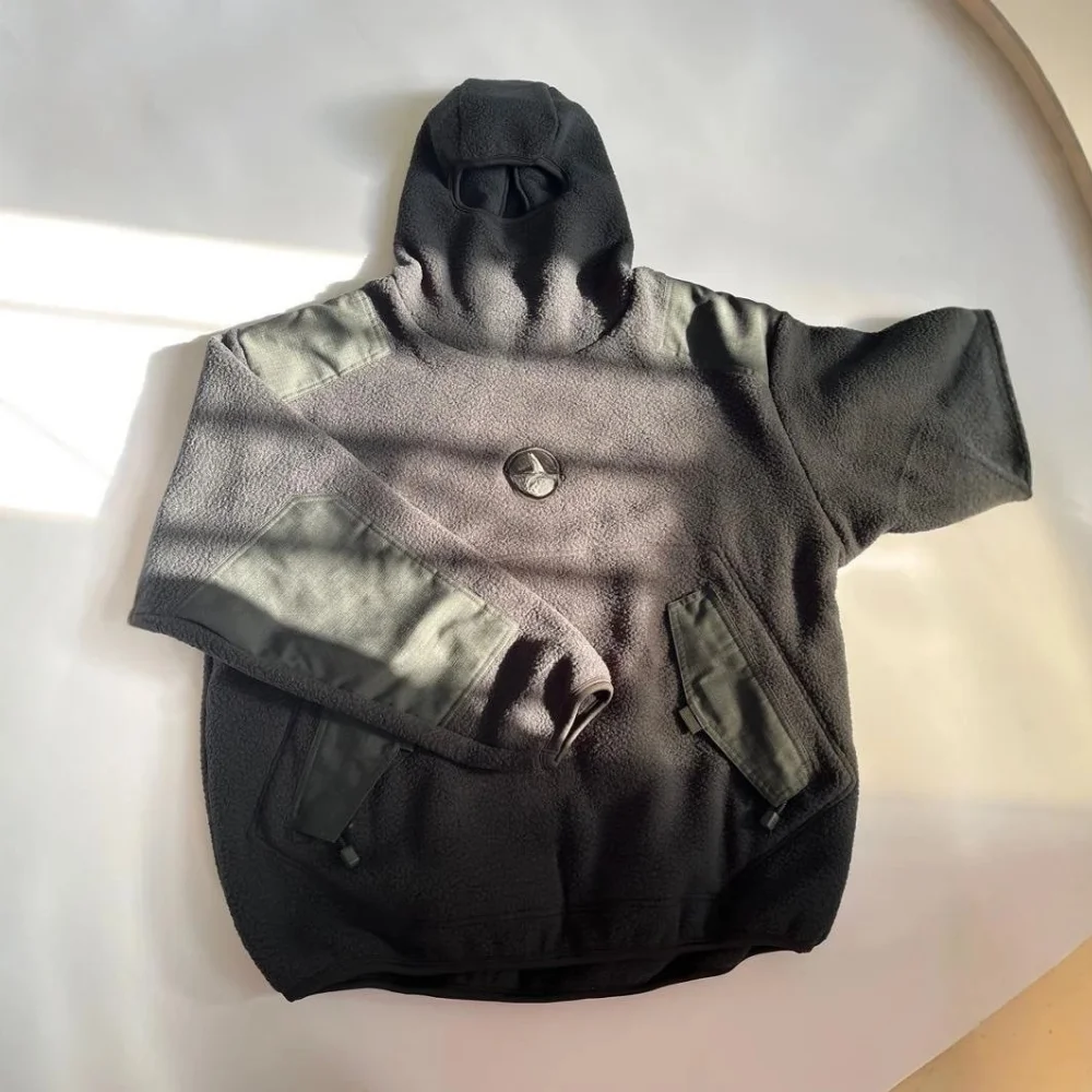 Dark gray fleece hooded jacket with contrast panels and front pockets