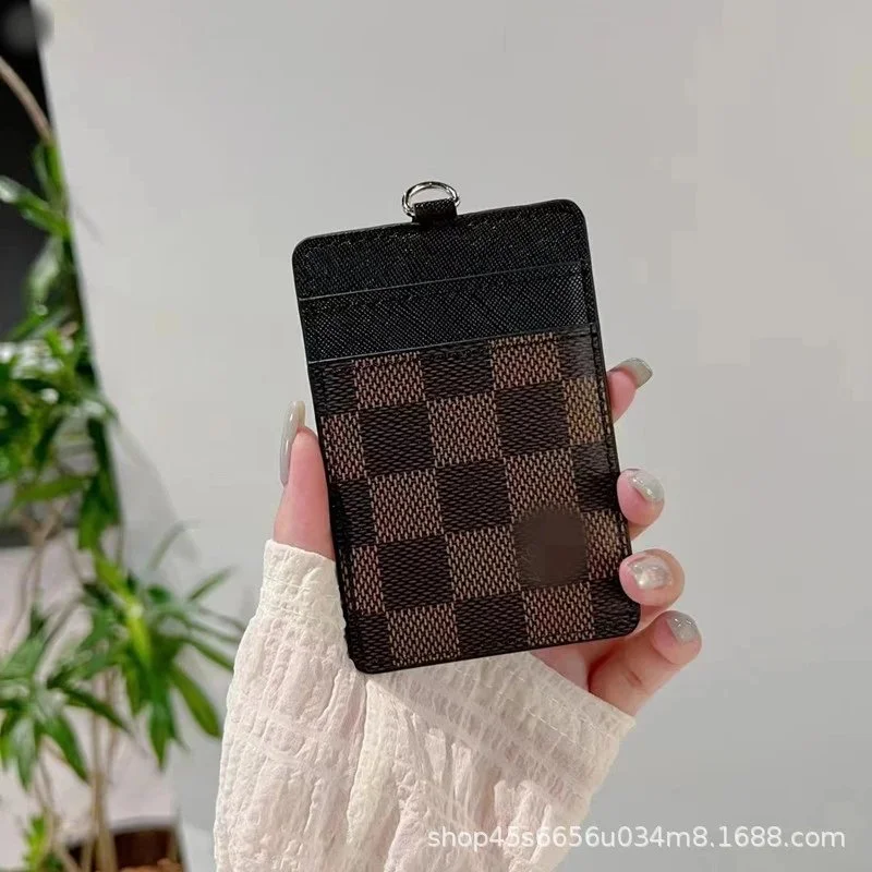 Rectangular lanyard card holder with checkerboard or monogram print, textured upper panel, metal ring