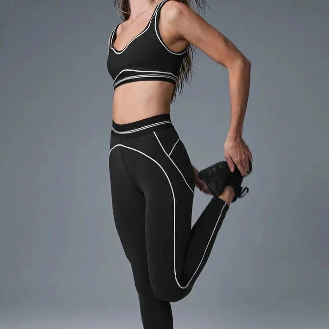 White high-waisted shorts with black piping seam detail