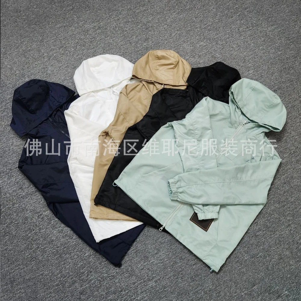 Lightweight shiny nylon hooded zip-up jacket with chest pocket and elastic cuffs