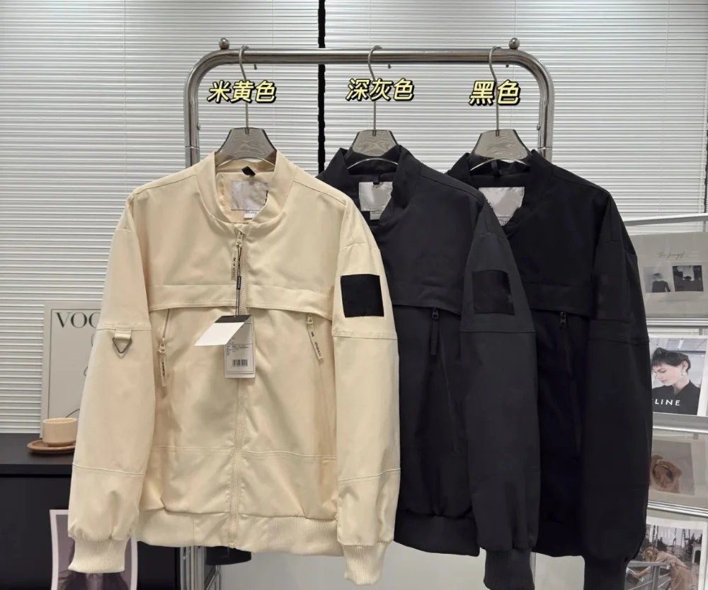 Cream and black nylon bomber jacket with sleeve patch and triangular hardware