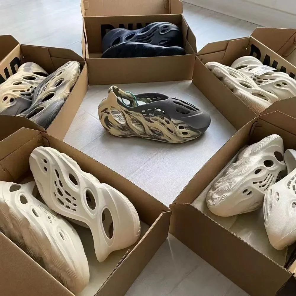 off-white monochrome foam clog with large cutouts and sculpted sole