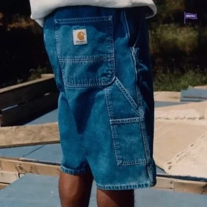 Carhartt Blue denim workwear shorts with large cargo pockets and rolled hem