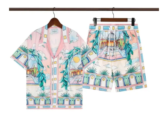 White short-sleeve shirt and shorts with multi-color striped trim and embroidered chest patch