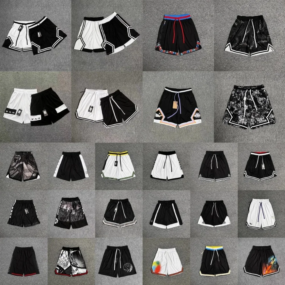 Black and white mesh shorts with chain trim hem