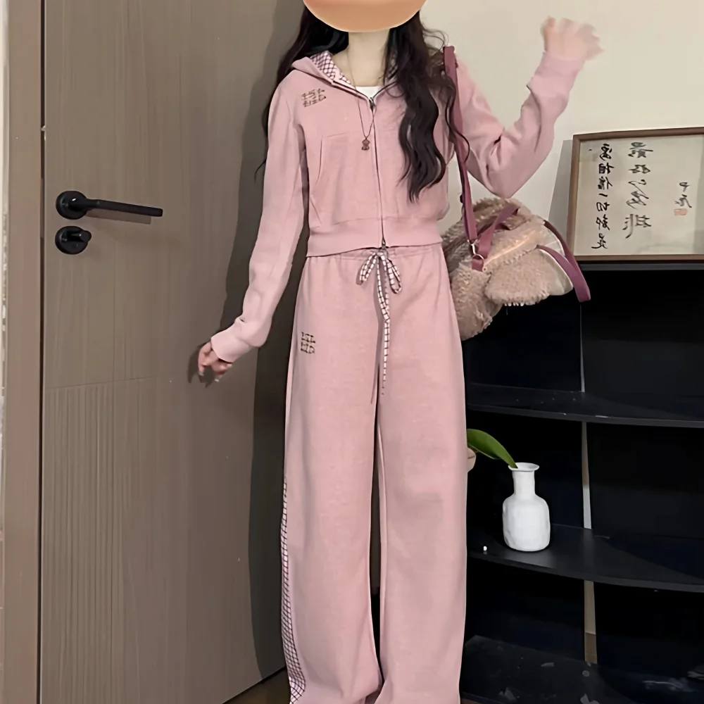 Pink zip-up hooded sweatshirt and wide-leg pants with checkerboard trim