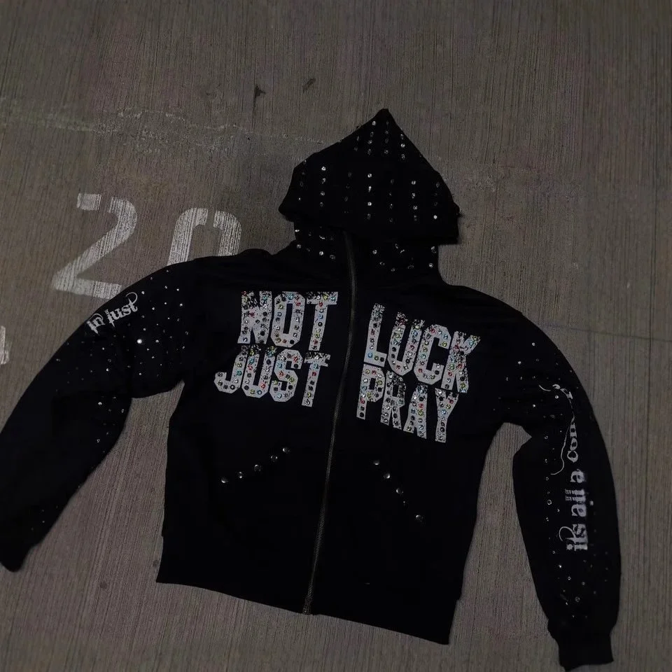 Black and grey zip-up hoodies with rhinestone lettering and hood embellishments