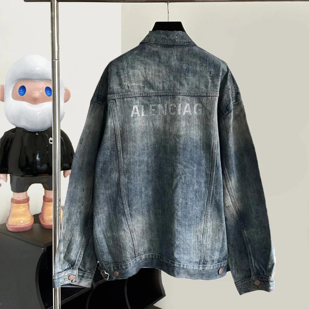 Balenciaga Distressed dark wash denim jacket with crystal lettering back