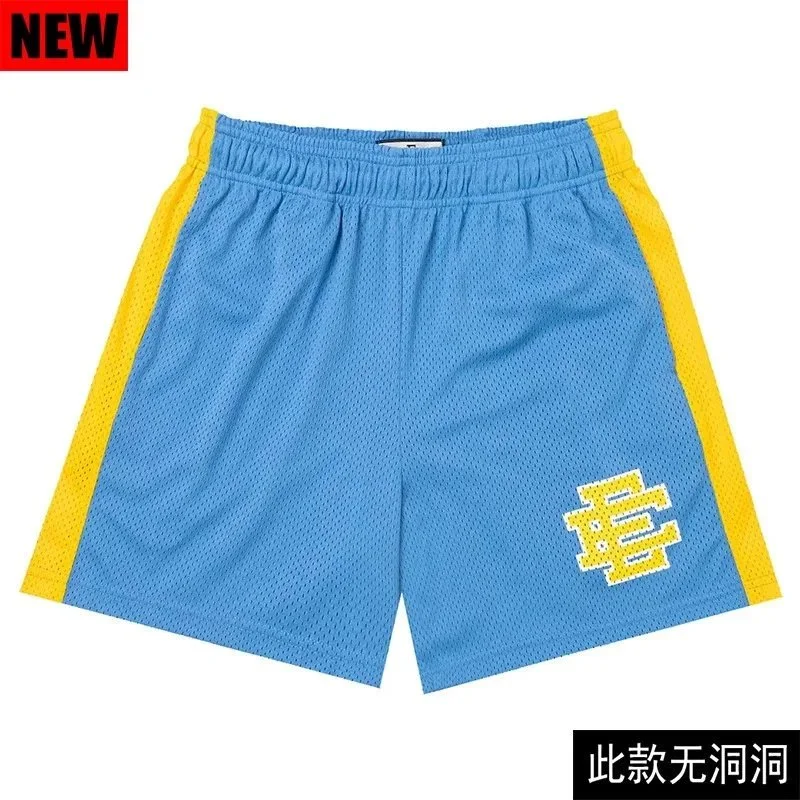 blue mesh shorts with orange side stripes and orange embroidered logo