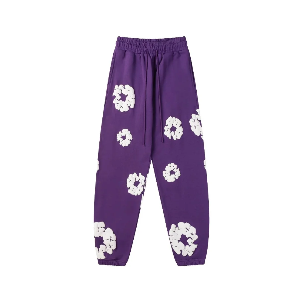 black sweatpants with white abstract floral print elastic waist cuffs