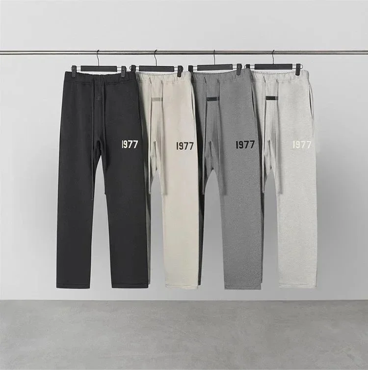 Black and oatmeal fleece jogger pants with 1977 side print
