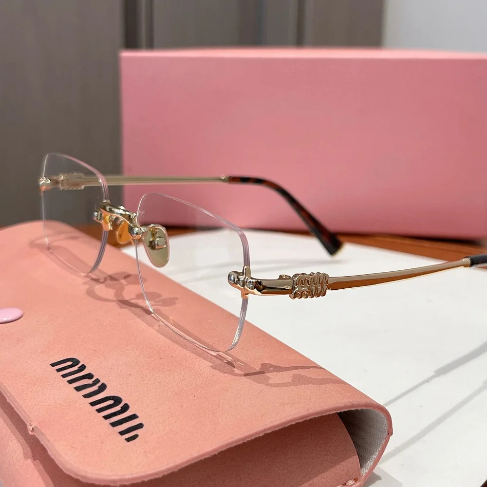 Miu Miu Gold-tone rimless eyeglasses with decorative hinge and tortoiseshell temple tips