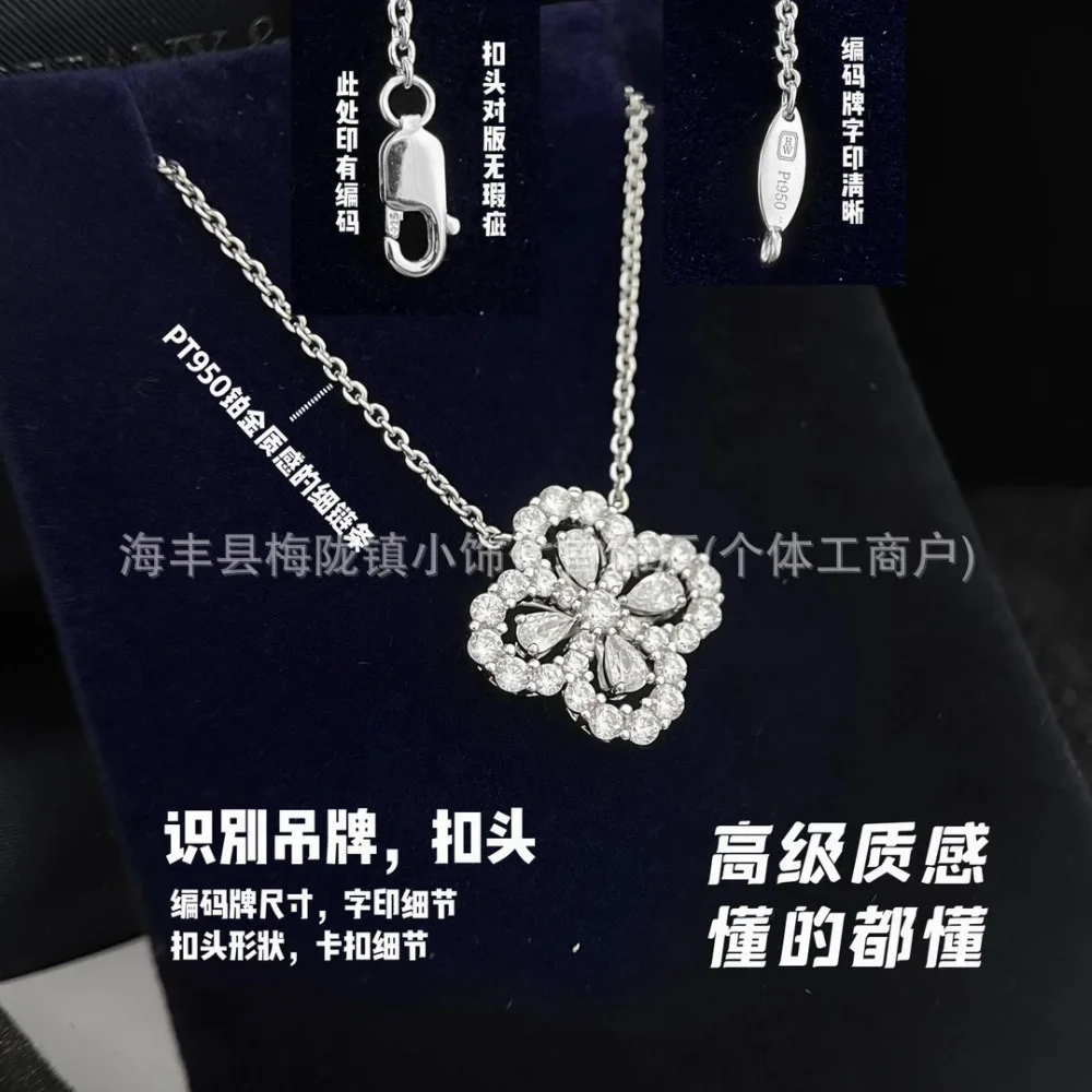 Silver chain clover pendant with pave crystals and teardrop blue stones