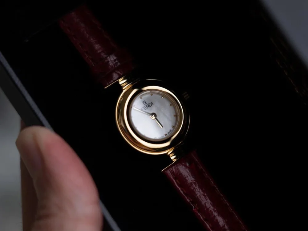 Fendi Gold-tone case mother-of-pearl dial burgundy leather strap wristwatch