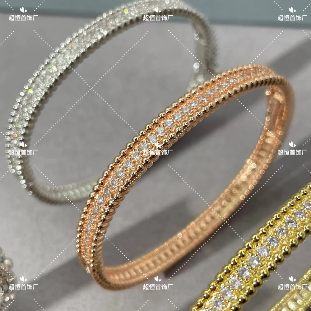 Gold tone beaded edge single row rhinestone bangle bracelet