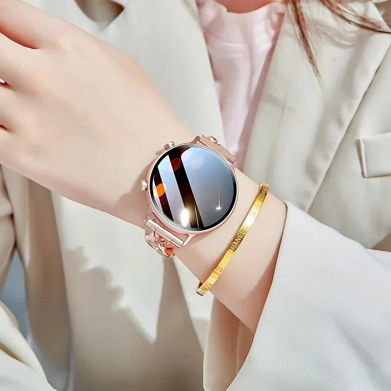 gold-tone smartwatch with white leather strap four-leaf clover charm rhinestone accents