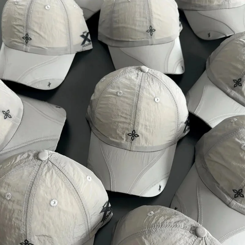 Lightweight crinkled fabric baseball cap with embroidered cross logo and side X-HOUS mark