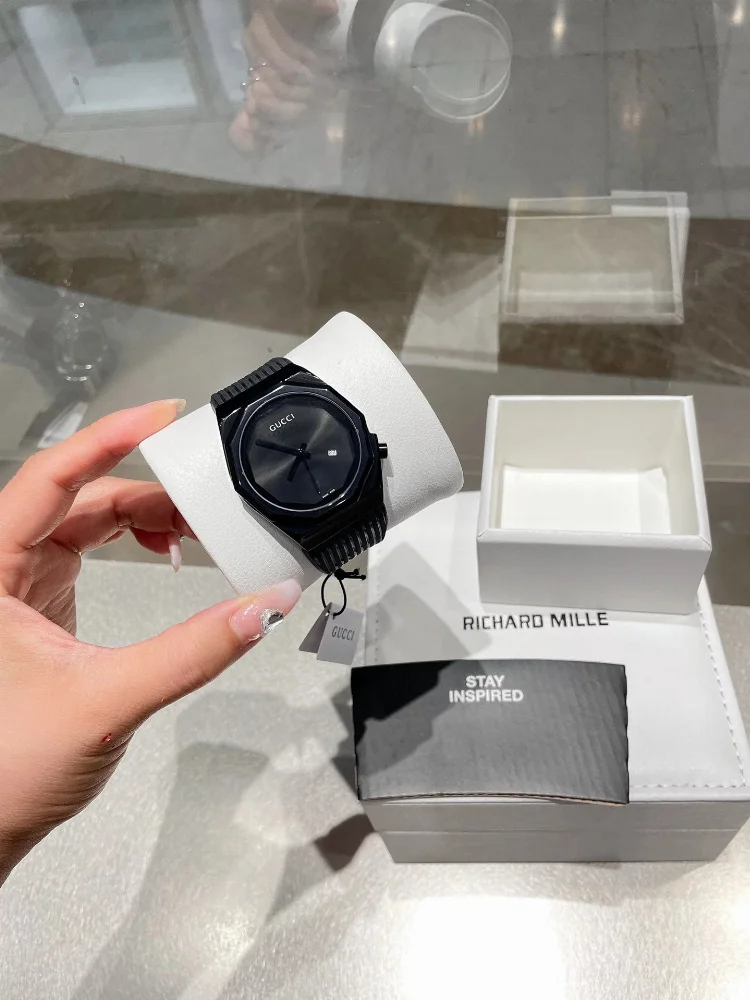 Gucci Black octagonal case watch with ribbed bezel and dark dial