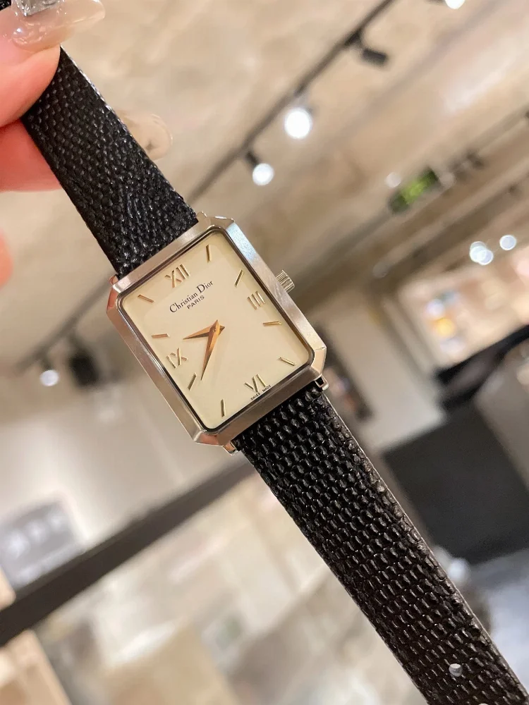 Christian Dior Rectangular silver case cream dial Roman numerals black textured strap