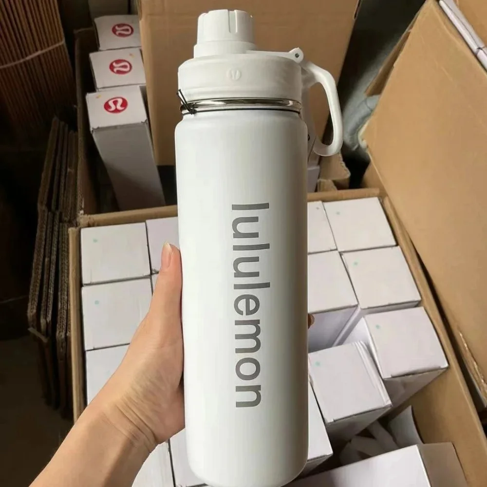Lululemon Matte white insulated water bottle with vertical brand text and handle