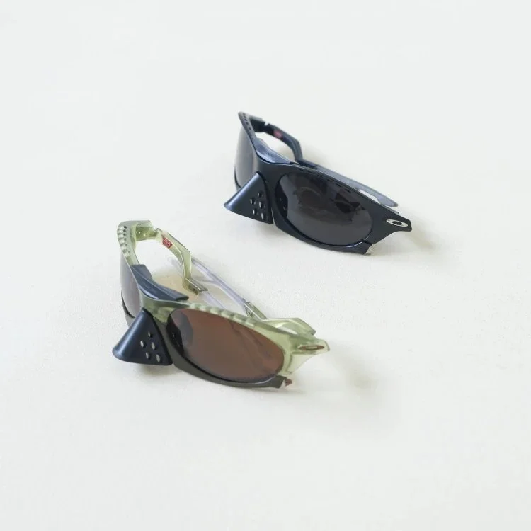 Oakley sporty wraparound sunglasses with side shields and perforated nose pads